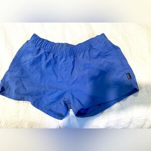 Patagonia purple women’s  Athletic Shorts with two front pockets.